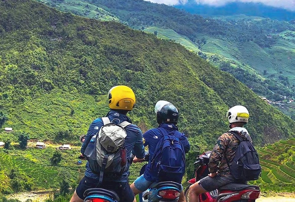 Enjoying every moment on the motorbike, gazing at the majestic scenery of Sapa's mountains and forests on the way to Cat Cat